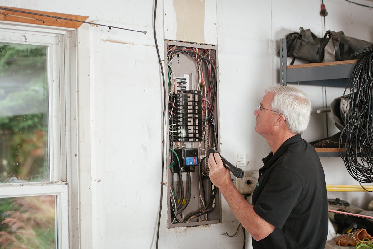 Electrician installing a fixture in a New Jersey home