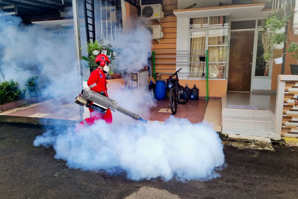 Pest control specialist treating a home, illustrating pest control marketing in Mount Olive NJ